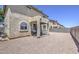 View of the backyard featuring a covered patio and a gravel landscape at 8769 W Washington St, Tolleson, AZ 85353