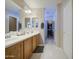 Bathroom features a dual sink vanity with walk-in closet at 8769 W Washington St, Tolleson, AZ 85353