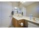 This bathroom features a single sink vanity, mirror, white toilet, and light walls at 8769 W Washington St, Tolleson, AZ 85353