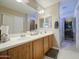 Bright bathroom features a dual sink vanity at 8769 W Washington St, Tolleson, AZ 85353