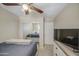 Bedroom featuring a closet with mirrored doors and ceiling fan at 8769 W Washington St, Tolleson, AZ 85353