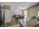 Open-concept kitchen with island that flows into the dining and living area of the home at 8769 W Washington St, Tolleson, AZ 85353