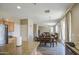 Well-designed kitchen that opens to the living room and dining room with an eat-in kitchen island at 8769 W Washington St, Tolleson, AZ 85353