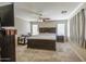 Large main bedroom boasts generous space, natural light, and a ceiling fan at 8769 W Washington St, Tolleson, AZ 85353