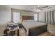 Spacious main bedroom featuring a ceiling fan and large windows, creating a comfortable and relaxing atmosphere at 8769 W Washington St, Tolleson, AZ 85353
