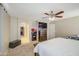 Spacious main bedroom features a walk-in closet and ceiling fan for added comfort at 8769 W Washington St, Tolleson, AZ 85353