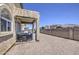 Covered patio with barbecue grill and gravel landscaping at 8769 W Washington St, Tolleson, AZ 85353