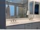 Bathroom features a double sink vanity and a large mirror at 9141 W Dreyfus Dr, Peoria, AZ 85381