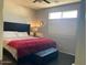 Comfortable bedroom with modern decor, natural light, and a cozy ambiance at 9141 W Dreyfus Dr, Peoria, AZ 85381