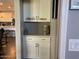 Built-in cabinets provide extra storage space and is conveniently located next to the kitchen at 9141 W Dreyfus Dr, Peoria, AZ 85381