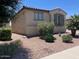 Beautiful single-story home featuring desert landscaping, neutral color palette, and shutters at 9141 W Dreyfus Dr, Peoria, AZ 85381