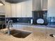 Spacious kitchen features modern appliances, granite countertops, and tiled backsplash at 9141 W Dreyfus Dr, Peoria, AZ 85381
