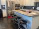 Eat-in kitchen featuring stainless steel appliances, tile backsplash and granite countertops at 9141 W Dreyfus Dr, Peoria, AZ 85381
