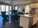 Bright and open concept kitchen with stainless appliances and a center island with bar stool seating at 9141 W Dreyfus Dr, Peoria, AZ 85381