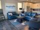 Spacious living room featuring tile floors, modern furniture, and natural light at 9141 W Dreyfus Dr, Peoria, AZ 85381