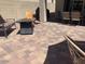 Paver patio featuring an outdoor seating area and partially covered porch at 9141 W Dreyfus Dr, Peoria, AZ 85381
