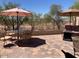 Paver patio with multiple seating areas and views of the surrounding desert landscape at 9141 W Dreyfus Dr, Peoria, AZ 85381