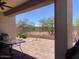 Spacious patio with interlocking pavers, table and chairs, and desert view at 9141 W Dreyfus Dr, Peoria, AZ 85381