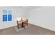 Bright breakfast nook features a round wooden table with seating and a window view at 9582 W Albert Ln, Peoria, AZ 85382