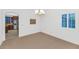 Bright dining room features white walls, window shutters, and carpet floors at 9582 W Albert Ln, Peoria, AZ 85382