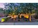 Inviting front yard showcases mature trees, manicured landscaping, and decorative rock at 9582 W Albert Ln, Peoria, AZ 85382