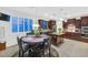 Eat-in kitchen offers dark wood cabinets, stainless appliances, granite counters, and tile floors at 9582 W Albert Ln, Peoria, AZ 85382