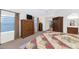 Spacious main bedroom with vaulted ceiling, sitting area, TV, and ensuite bath access at 9582 W Albert Ln, Peoria, AZ 85382