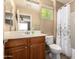 Bathroom featuring a vanity with a sink, a mirror, toilet, and a shower and tub combination at 10062 E Isleta Ave, Mesa, AZ 85209