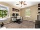 Bedroom featuring a desk, office chair, dual monitors, and a window, providing ample natural light at 10062 E Isleta Ave, Mesa, AZ 85209