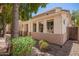 Charming two-story home with a stucco exterior, well-maintained landscaping, and a private gated entrance at 10062 E Isleta Ave, Mesa, AZ 85209