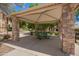 Community picnic area with gazebo featuring stone pillars and views of lush green park at 10062 E Isleta Ave, Mesa, AZ 85209