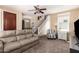 Inviting living room with a staircase, comfortable seating, and natural light, creating a warm atmosphere at 10062 E Isleta Ave, Mesa, AZ 85209