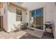 Cozy outdoor patio area with seating and a barbecue grill, perfect for outdoor dining and entertainment at 10062 E Isleta Ave, Mesa, AZ 85209