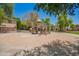 Community playground with slides, swings, and park benches at 10062 E Isleta Ave, Mesa, AZ 85209
