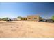 Exterior view of the property with ample parking and additional garage, providing space for work and play at 1032 E Dolores Rd, Phoenix, AZ 85086