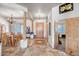 Inviting foyer with a wood door, decorative tile flooring, and an open layout to the adjacent dining area at 1032 E Dolores Rd, Phoenix, AZ 85086