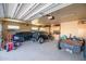 Spacious garage with multiple cars and work area, offering ample storage and workspace for projects and hobbies at 1032 E Dolores Rd, Phoenix, AZ 85086
