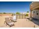 Backyard view with a hot tub, lounge chairs, and desert landscaping at 1032 E Dolores Rd, Phoenix, AZ 85086