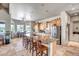 Expansive kitchen with a large center island, stainless steel appliances, and adjacent dining area at 1032 E Dolores Rd, Phoenix, AZ 85086