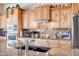 Close-up of the kitchen showcasing stainless steel appliances, custom cabinets, and sleek granite countertops at 1032 E Dolores Rd, Phoenix, AZ 85086