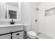 This bathroom has a white vanity with a black faucet and a walk in shower at 10429 W Miami St, Tolleson, AZ 85353