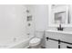 A fully remodeled bathroom has a shower/tub combo and stylish vanity at 10429 W Miami St, Tolleson, AZ 85353