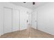 A secondary bedroom features tile flooring, closet, and open entry way at 10429 W Miami St, Tolleson, AZ 85353