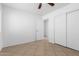 A secondary bedroom features tile flooring, closet and open entry way at 10429 W Miami St, Tolleson, AZ 85353