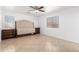 Primary bedroom with tiled floors, a comfortable bed, and windows with blinds at 10429 W Miami St, Tolleson, AZ 85353
