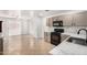 Modern kitchen with stainless steel appliances, white countertops, and tile floors at 10429 W Miami St, Tolleson, AZ 85353