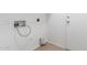 Laundry room features hookups, tile floors, and white walls at 10429 W Miami St, Tolleson, AZ 85353