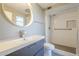Modern bathroom featuring a vessel sink, stylish vanity, and walk-in shower at 11133 W Cameo Dr, Sun City, AZ 85351