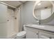 A bright bathroom with a new shower, toilet, modern vanity, and skylight at 11133 W Cameo Dr, Sun City, AZ 85351