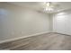 Bedroom featuring wood-look floors and a ceiling fan at 11133 W Cameo Dr, Sun City, AZ 85351